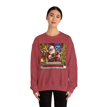 Even Santa Knows It’s the Giving That Matters Most  Christmas Giving-Themed Sweatshirt Unisex Heavy Blend Crewneck Sweatshirt