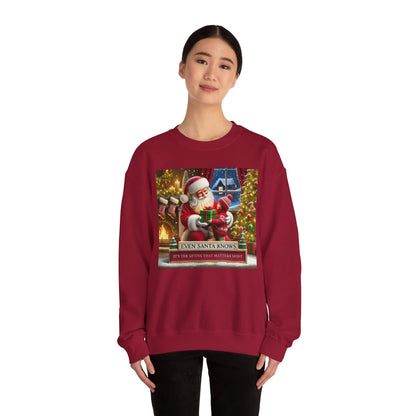 Even Santa Knows It’s the Giving That Matters Most  Christmas Giving-Themed Sweatshirt Unisex Heavy Blend Crewneck Sweatshirt