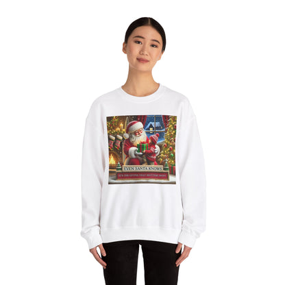 Even Santa Knows It’s the Giving That Matters Most  Christmas Giving-Themed Sweatshirt Unisex Heavy Blend Crewneck Sweatshirt